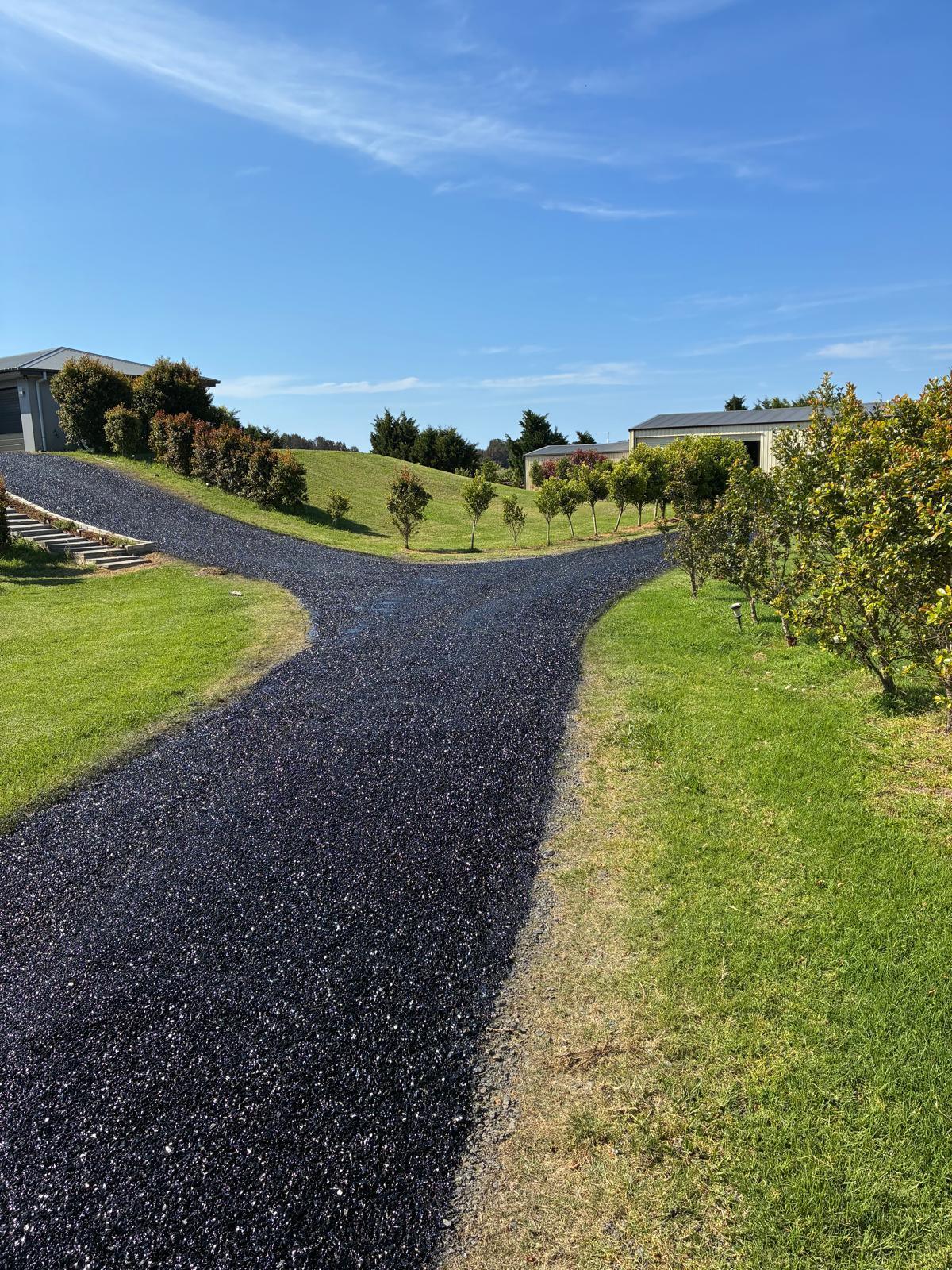 Curved asphalt driveway in scenic Perth estate WA